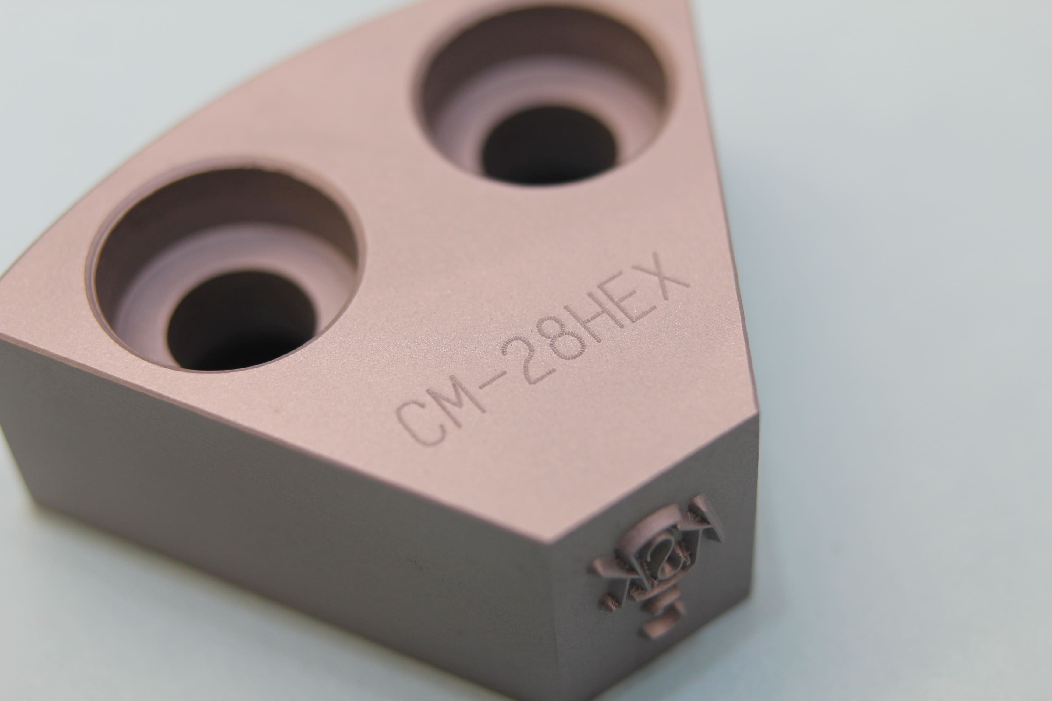 Image of hardened steel engraved with text and numbers 'CM-28HEX'.