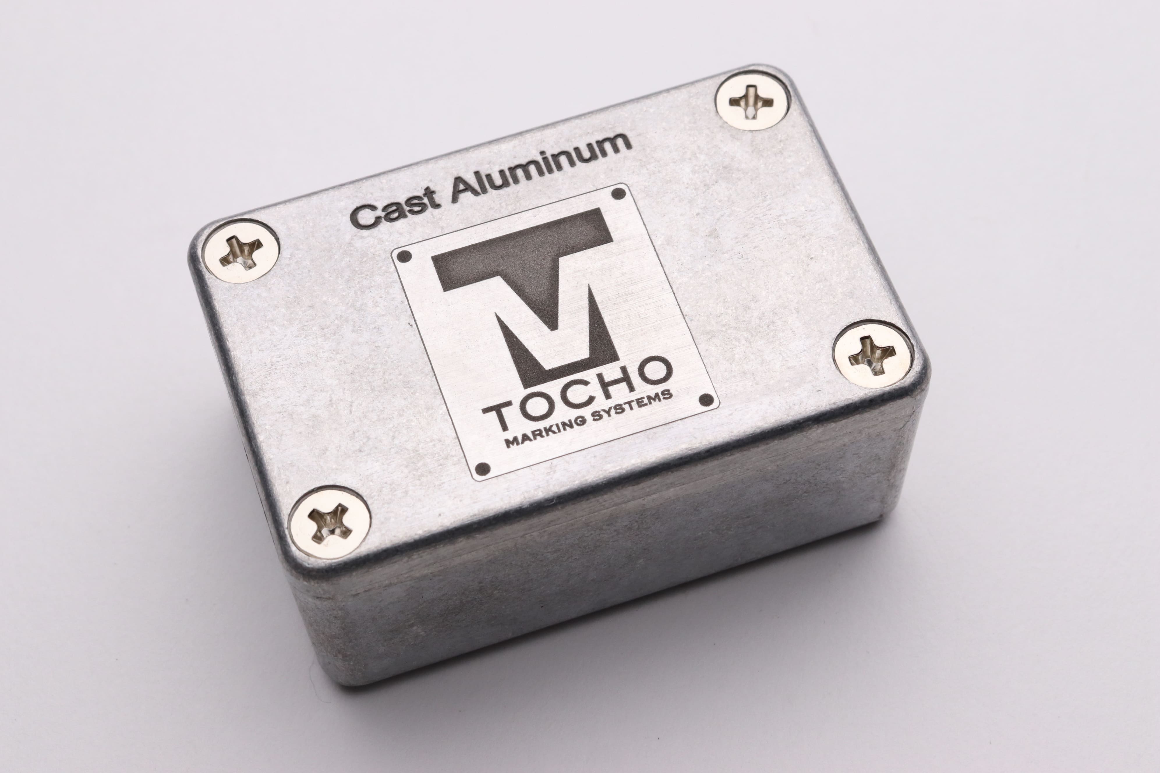 Image of cast aluminum engraved with the text 'Cast Aluminum' and the Tocho logo