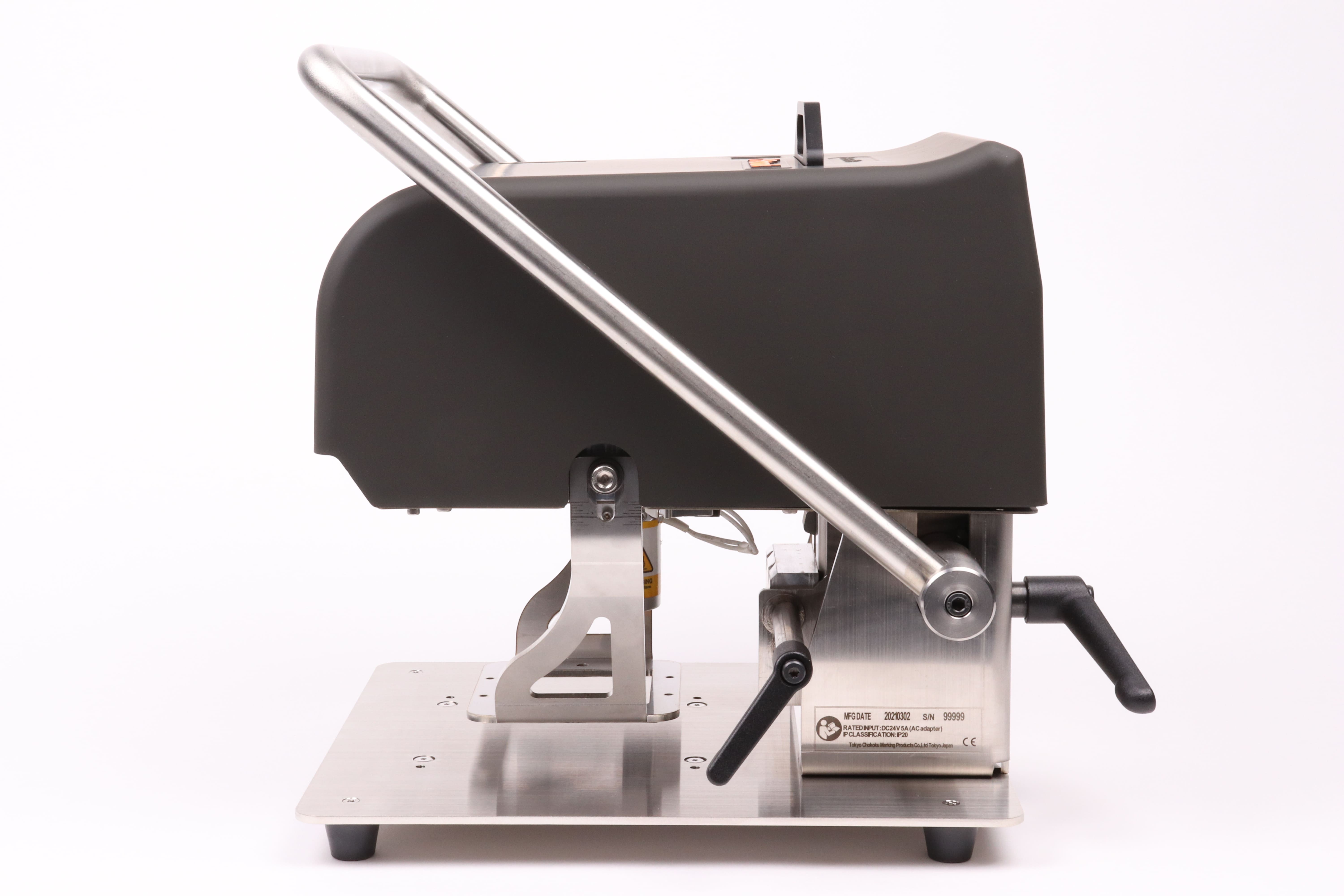 Image of the side view of the black Patmark-desktop unit from the Patmark series, with the fixation bar in the raised position.