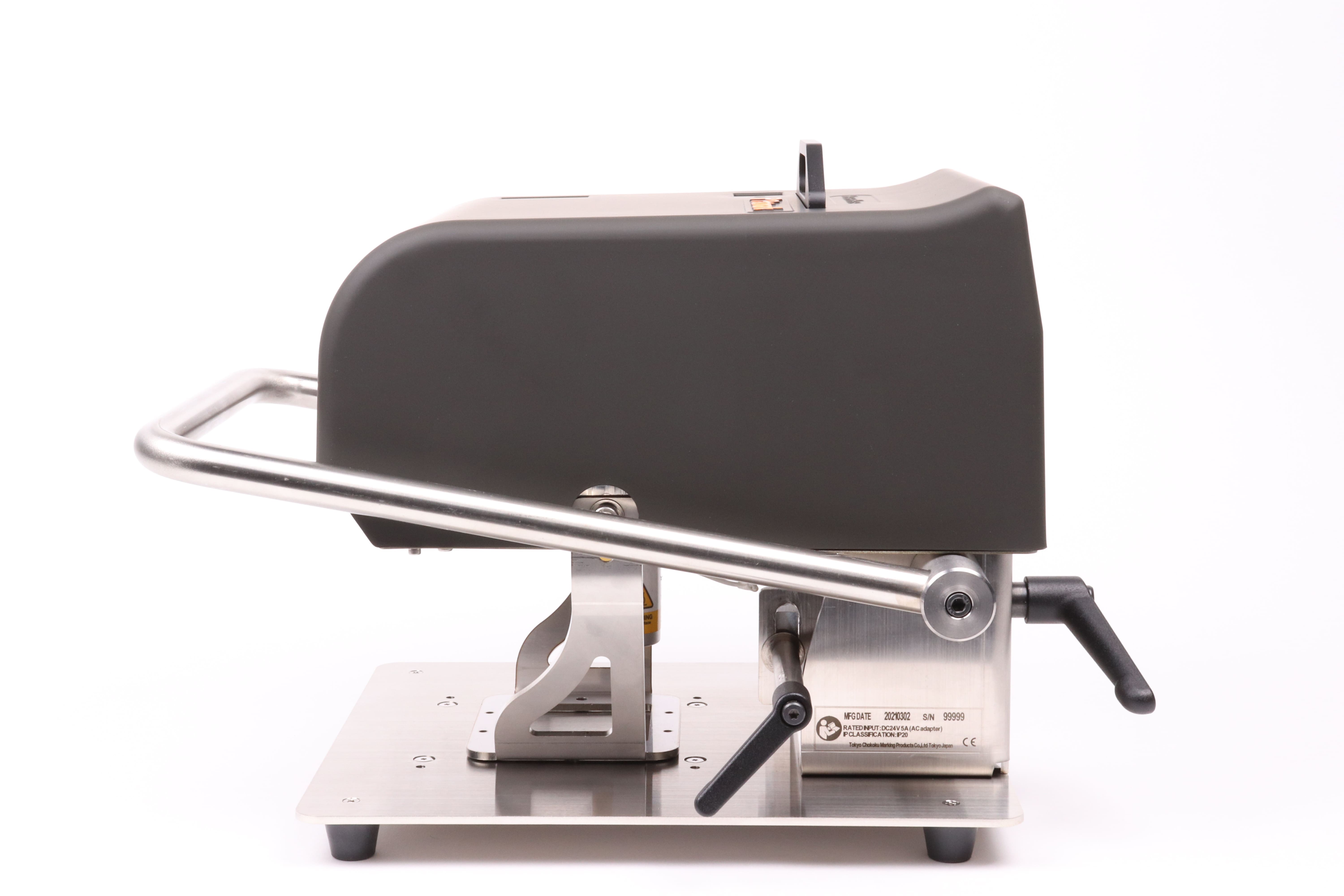 Image of the side view of the black Patmark-desktop unit from the Patmark series, with the fixation bar in the lowered position.