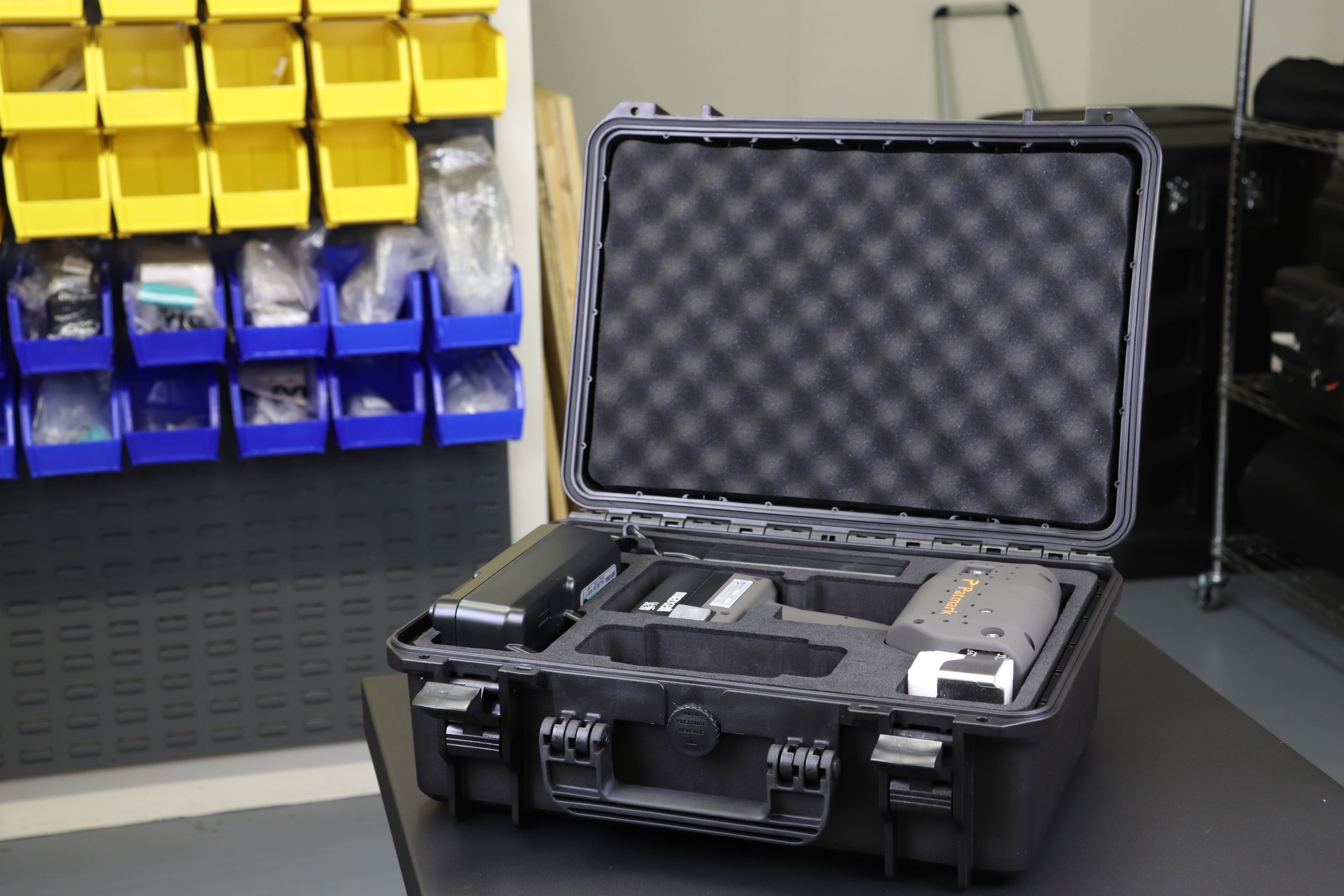 Image of a Patmark storage box with a black Patmark unit inside