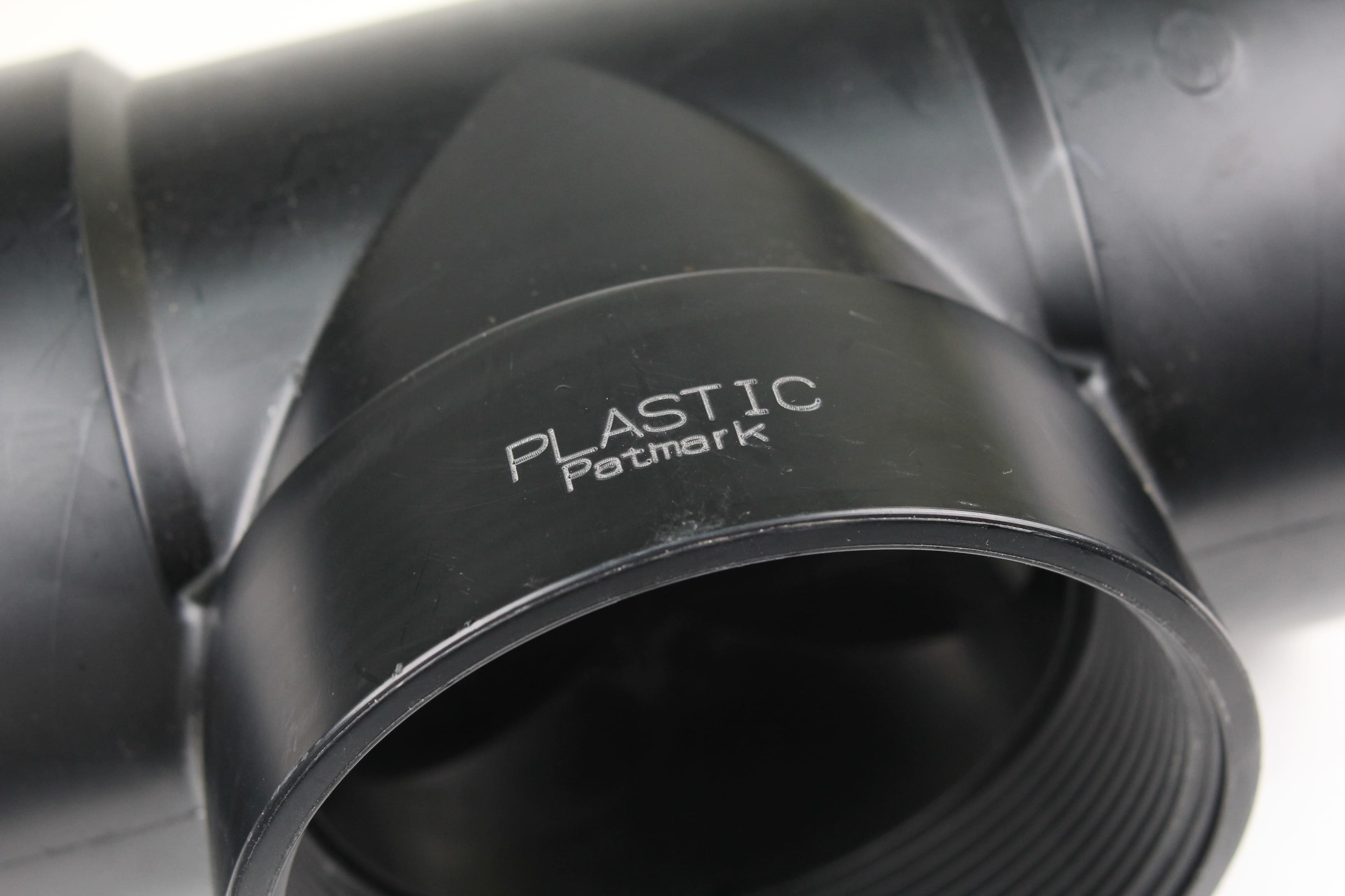 Image of plastic material engraved with the text 'PLASTIC Patmark'.
